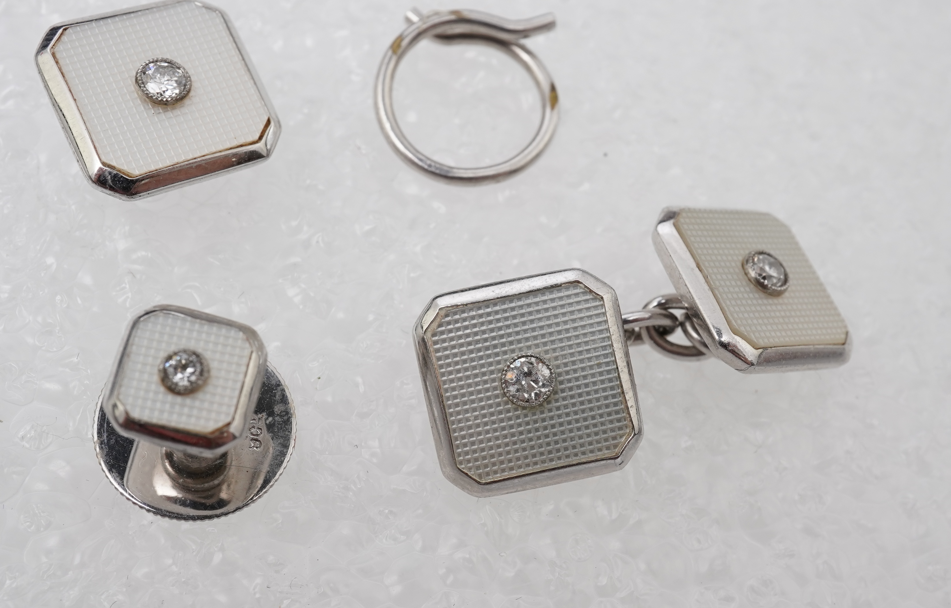 An Art Deco mother of pearl and diamond dress set, circa 1930